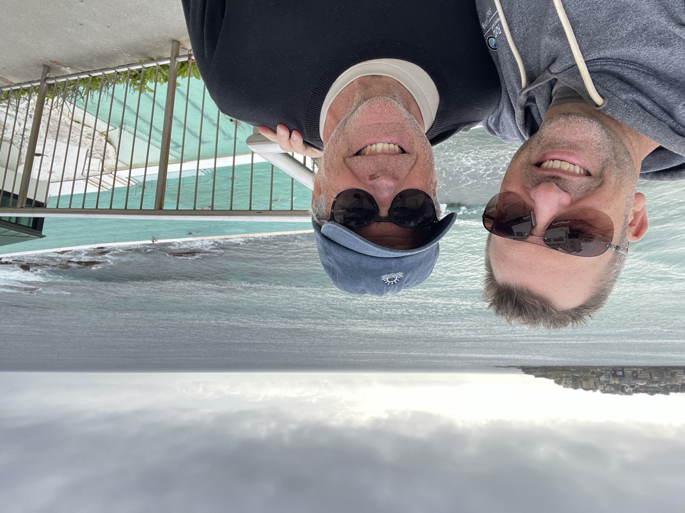 Marc Schregardus and Garry Luscombe at Bondi, with the Icebergs pool and ocean behind them